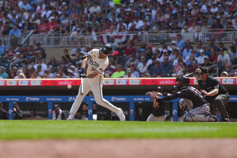 Aug 11, 2024; Minneapolis, Minnesota, USA; Minnesota Twins left fielder Matt Wallner (38) hits a single during the sixth inning against the Cleveland Guardians at Target Field. Mandatory Credit: Jordan Johnson-USA TODAY Sports