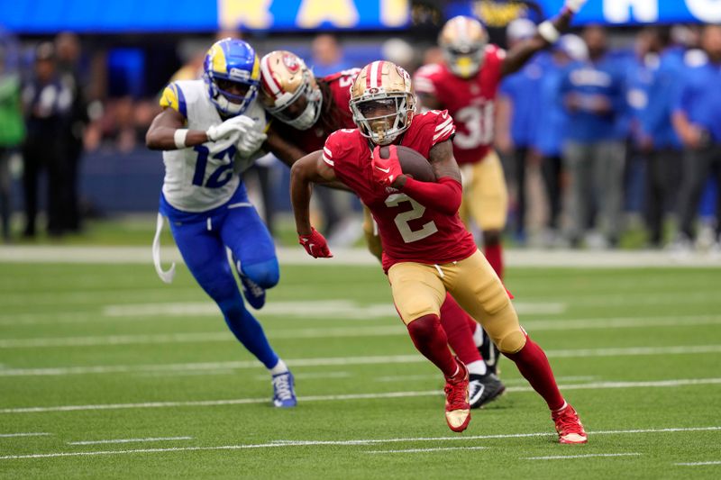 San Francisco 49ers cornerback Deommodore Lenoir runs the ball after intercepting a pass during the second half of an NFL football game against the Los Angeles Rams Sunday, Sept. 17, 2023, in Inglewood, Calif. (AP Photo/Ashley Landis)