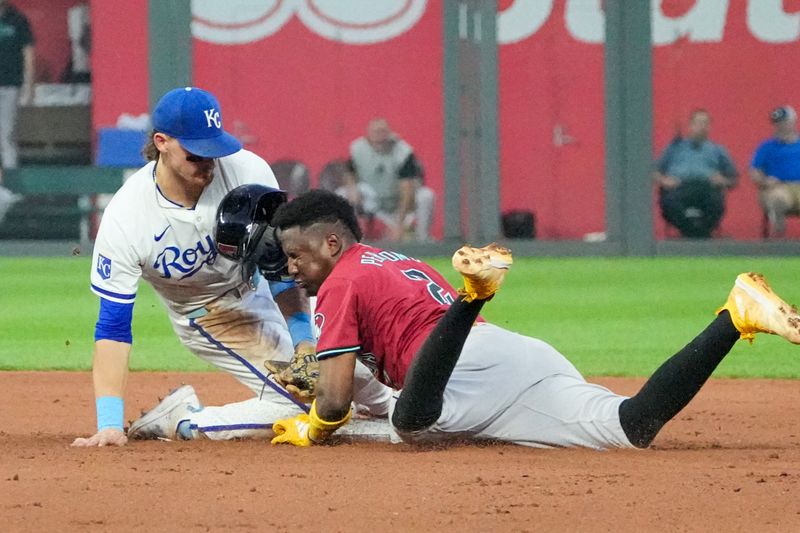 Jul 24, 2024; Kansas City, Missouri, USA; Kansas City Royals shortstop Bobby Witt Jr. (7) misses the tag as Arizona Diamondbacks shortstop Geraldo Perdomo (2) reaches second safely in the fifth inning at Kauffman Stadium. Mandatory Credit: Denny Medley-USA TODAY Sports