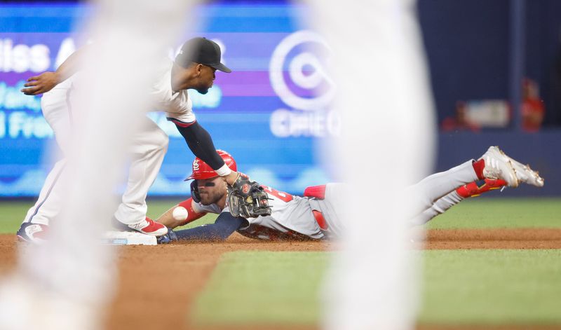 Jun 18, 2024; Miami, Florida, USA; St. Louis Cardinals center fielder Michael Siani (63) slides safely into second after his double against the Miami Marlins in the second inning at loanDepot Park. Mandatory Credit: Rhona Wise-USA TODAY Sports