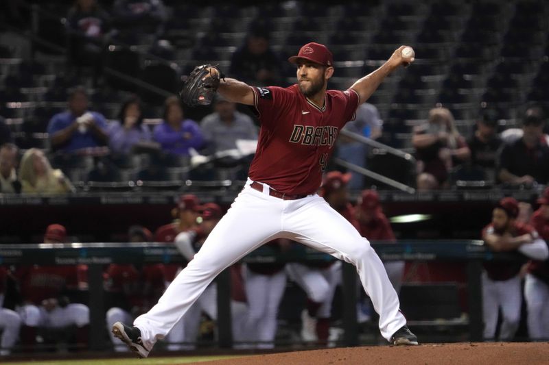 Mar 27, 2023; Phoenix, Arizona, USA; Arizona Diamondbacks starting pitcher Madison Bumgarner (40) pitches against the Cleveland Guardians during the second inning at Chase Field. Mandatory Credit: Joe Camporeale-USA TODAY Sports