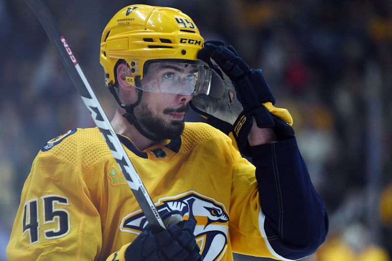 Mar 5, 2024; Nashville, Tennessee, USA; Nashville Predators defenseman Alexandre Carrier (45) waits for a face off during the first period against the Montreal Canadiens at Bridgestone Arena. Mandatory Credit: Christopher Hanewinckel-USA TODAY Sports