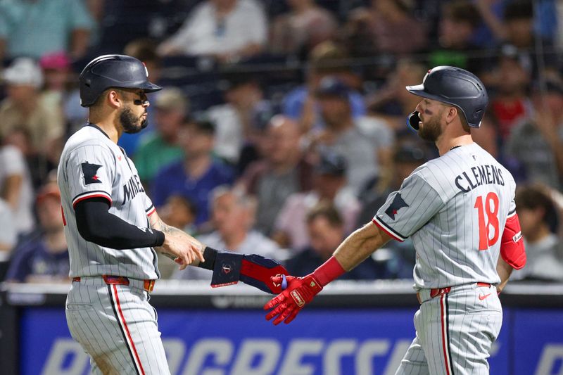 May 27, 2025; Tampa, Florida, USA; Minnesota Twins shortstop Carlos Correa (4) reacts with second baseman Kody Clemens (18) after scoring a run against the Tampa Bay Rays in the eighth inning at George M. Steinbrenner Field. Mandatory Credit: Nathan Ray Seebeck-Imagn Images