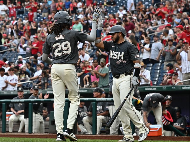 Aug 10, 2024; Washington, District of Columbia, USA;  Washington Nationals left fielder James Wood (29) celebrates hitting a home run with catcher Keibert Ruiz (20) during the second inning against the Los Angeles Angels at Nationals Park. Mandatory Credit: James A. Pittman-USA TODAY Sports