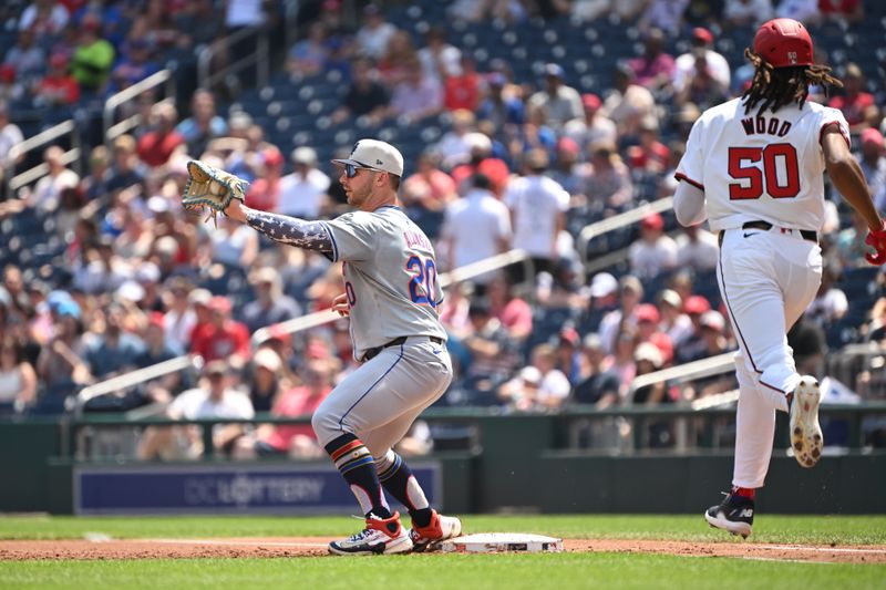 Jul 4, 2024; Washington, District of Columbia, USA; New York Mets first baseman Pete Alonso (20) catches the ball at first base for n out in front of fWashington Nationals center fielder James Wood (50) at Nationals Park. Mandatory Credit: Rafael Suanes-USA TODAY Sports
