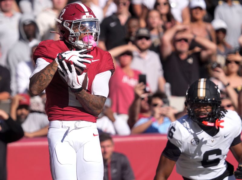 Oct 4, 2025; Tuscaloosa, Alabama, USA; Alabama wide receiver Ryan Williams (2) catches a touchdown pass in front Vanderbilt defensive back Jordan Matthews (6) at Saban Field at Bryant-Denny Stadium. Mandatory Credit: Gary Cosby Jr.-USA TODAY Network via Imagn Images