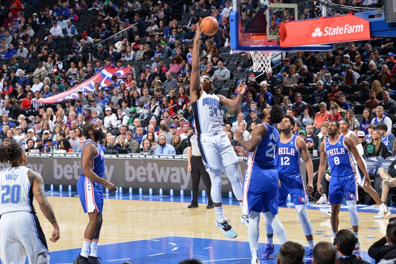 PHILADELPHIA, PA - JANUARY 30: Wendell Carter Jr. #34 of the Orlando Magic shoots the ball during the game against the Philadelphia 76ers on January 30, 2023 at the Wells Fargo Center in Philadelphia, Pennsylvania NOTE TO USER: User expressly acknowledges and agrees that, by downloading and/or using this Photograph, user is consenting to the terms and conditions of the Getty Images License Agreement. Mandatory Copyright Notice: Copyright 2023 NBAE (Photo by Jesse D. Garrabrant/NBAE via Getty Images)