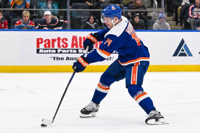 Jan 27, 2024; Elmont, New York, USA; New York Islanders center Bo Horvat (14) attempts a shot against the Florida Panthers during the second period at UBS Arena. Mandatory Credit: Dennis Schneidler-USA TODAY Sports