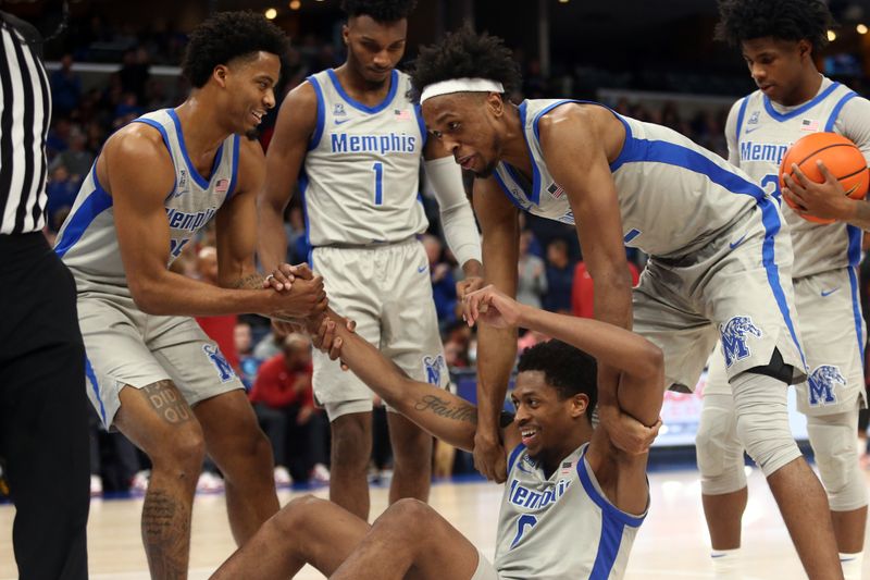 Feb 12, 2023; Memphis, Tennessee, USA; Memphis Tigers guard Jayden Hardaway (25) and forward DeAndre Williams (12) reacts with guard Elijah McCadden (0) after a charge call during the second half against the Temple Owls at FedExForum. Mandatory Credit: Petre Thomas-USA TODAY Sports