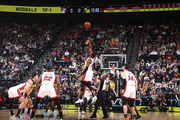 SALT LAKE CITY, UT - DECEMBER 30: John Collins #20 of the Utah Jazz and Bam Adebayo #13 of the Miami Heat go up for the opening tip off on December 30, 2023 at Delta Center in Salt Lake City, Utah. NOTE TO USER: User expressly acknowledges and agrees that, by downloading and or using this Photograph, User is consenting to the terms and conditions of the Getty Images License Agreement. Mandatory Copyright Notice: Copyright 2023 NBAE (Photo by Melissa Majchrzak/NBAE via Getty Images)