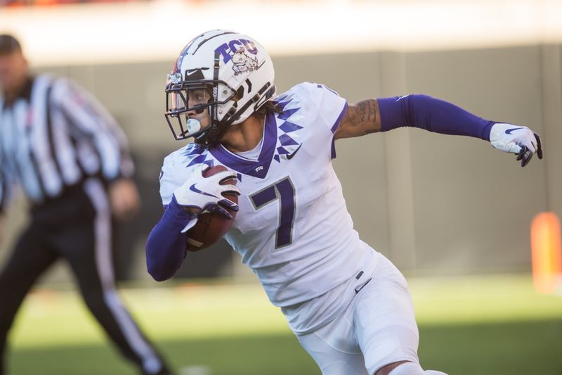 Nov 2, 2019; Stillwater, OK, USA; TCU Horned Frogs safety Trevon Moehrig (7) turns to run after an interception during the fourth quarter of the game against the Oklahoma State Cowboys at Boone Pickens Stadium. Oklahoma State defeated TCU 34-27. Mandatory Credit: Brett Rojo-USA TODAY Sports