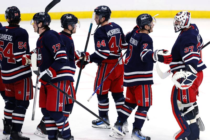 Nov 9, 2024; Winnipeg, Manitoba, CAN; Winnipeg Jets celebrate their victory over the Dallas Stars at Canada Life Centre. Mandatory Credit: James Carey Lauder-Imagn Images