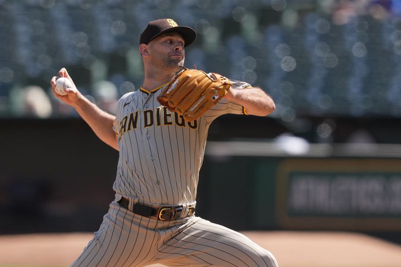 Sep 17, 2023; Oakland, California, USA; San Diego Padres starting pitcher Nick Martinez (21) throws a pitch against the Oakland Athletics during the first inning at Oakland-Alameda County Coliseum. Mandatory Credit: Darren Yamashita-USA TODAY Sports