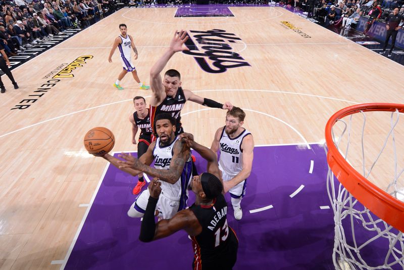 SACRAMENTO, CA - JANUARY 6: Malik Monk #0 of the Sacramento Kings drives to the basket during the game against the Miami Heat on January 6, 2025 at Golden 1 Center in Sacramento, California. NOTE TO USER: User expressly acknowledges and agrees that, by downloading and or using this Photograph, user is consenting to the terms and conditions of the Getty Images License Agreement. Mandatory Copyright Notice: Copyright 2025 NBAE (Photo by Rocky Widner/NBAE via Getty Images)