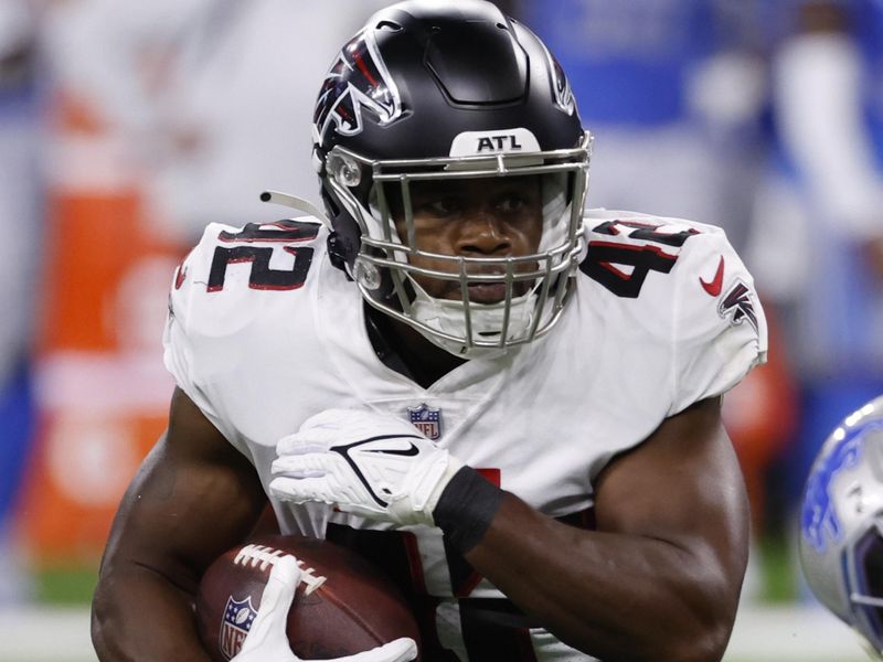 Atlanta Falcons running back Caleb Huntley (42) rushes in the first half against the Detroit Lions during an NFL football game, Friday, Aug. 12, 2022, in Detroit. (AP Photo/Rick Osentoski)