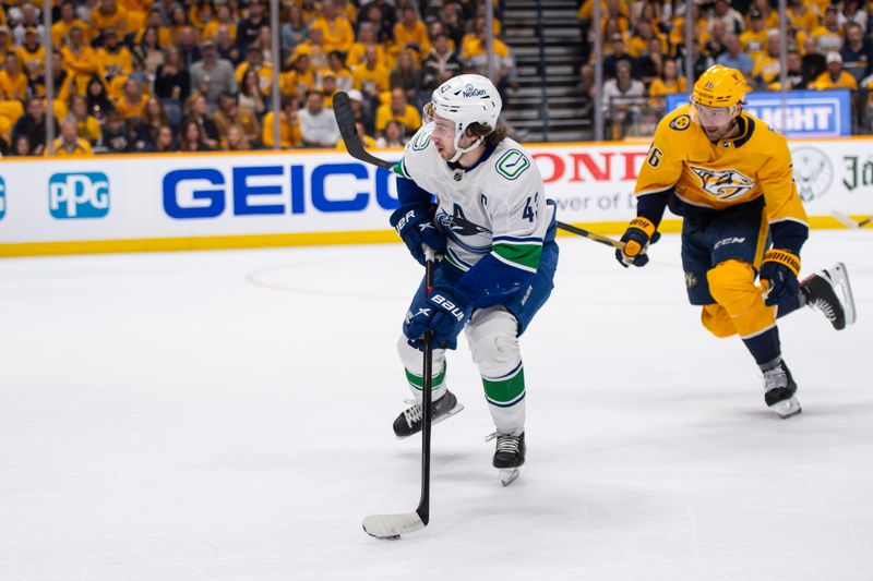 Apr 26, 2024; Nashville, Tennessee, USA; Vancouver Canucks defenseman Quinn Hughes (43) skates against the Nashville Predators during the first period in game three of the first round of the 2024 Stanley Cup Playoffs at Bridgestone Arena. Mandatory Credit: Steve Roberts-USA TODAY Sports