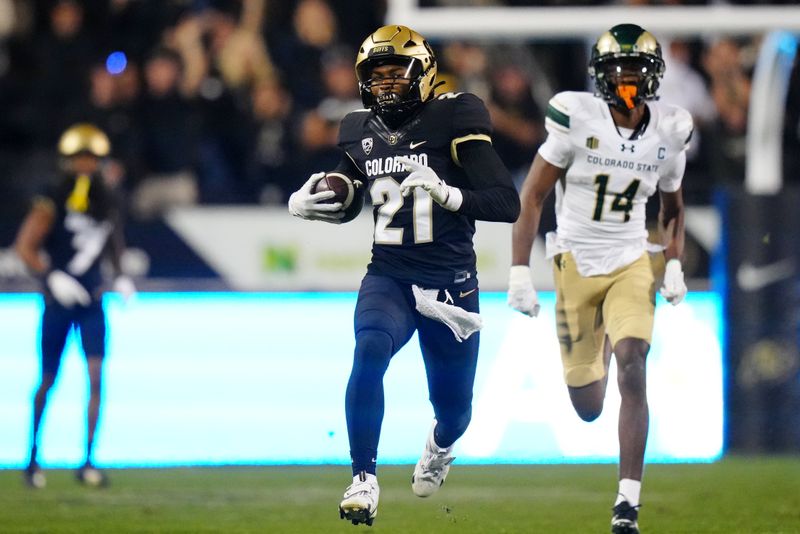 Sep 16, 2023; Boulder, Colorado, USA; Colorado Buffaloes safety Shilo Sanders (21) runs for a touchdown after making an interception against the Colorado State Rams during the first half at Folsom Field. Mandatory Credit: Ron Chenoy-USA TODAY Sports