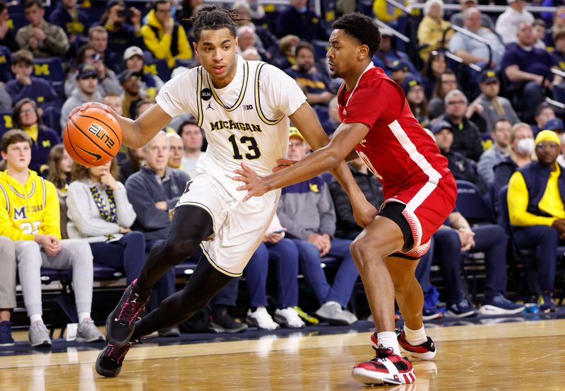 Feb 8, 2023; Ann Arbor, Michigan, USA;  Michigan Wolverines guard Jett Howard (13) dribbles on Nebraska Cornhuskers guard Jamarques Lawrence (10) in the first half at Crisler Center. Mandatory Credit: Rick Osentoski-USA TODAY Sports