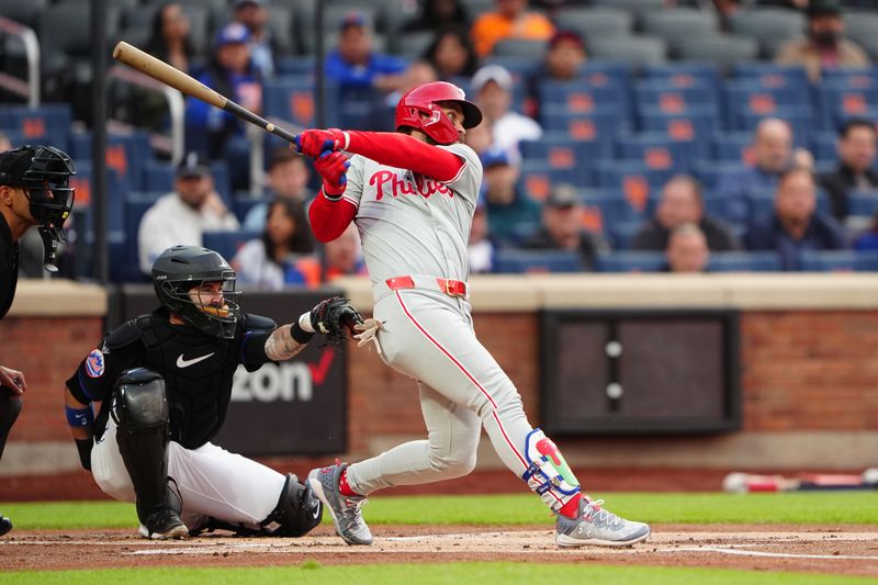 May 13, 2024; New York City, New York, USA; Philadelphia Phillies first baseman Bryce Harper (3) hits a single against the New York Mets during the first inning at Citi Field. Mandatory Credit: Gregory Fisher-USA TODAY Sports