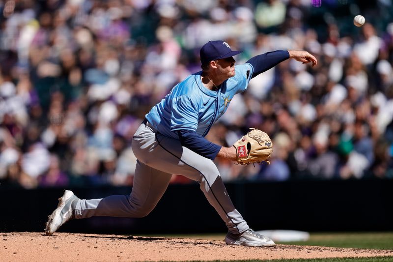 Apr 7, 2024; Denver, Colorado, USA; Tampa Bay Rays pitcher Garrett Cleavinger (60) pitches in the seventh inning against the Colorado Rockies at Coors Field. Mandatory Credit: Isaiah J. Downing-USA TODAY Sports