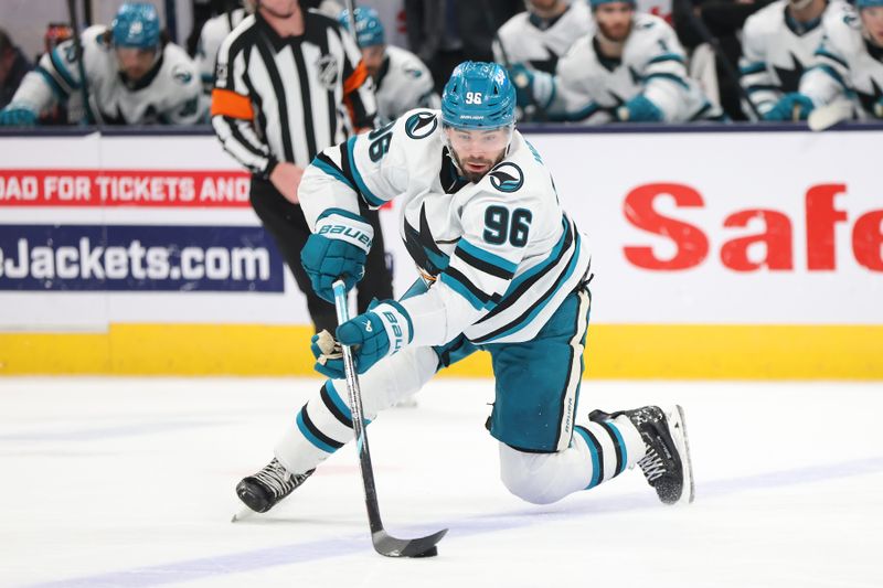 Jan 16, 2025; Columbus, Ohio, USA;  San Jose Sharks defenseman Jake Walman (96) controls the puck during the second period against the Columbus Blue Jackets at Nationwide Arena. Mandatory Credit: Joseph Maiorana-Imagn Images