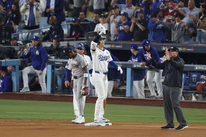 Oct 25, 2024; Los Angeles, California, USA; Los Angeles Dodgers designated hitter player Shohei Ohtani (17) celebrates after getting a hit in the eighth inning against the New York Yankees during game one of the 2024 MLB World Series at Dodger Stadium. Mandatory Credit:  Jason Parkhurst-Imagn Images