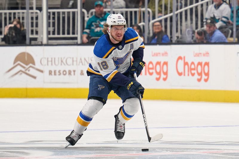 Apr 6, 2024; San Jose, California, USA; St. Louis Blues center Robert Thomas (18) plays the puck against the San Jose Sharks during the first period at SAP Center at San Jose. Mandatory Credit: Robert Edwards-USA TODAY Sports