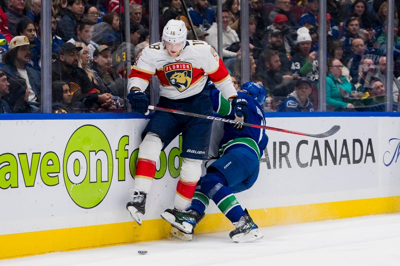 Dec 14, 2023; Vancouver, British Columbia, CAN; Florida Panthers forward Steven Lorentz (18) checks Vancouver Canucks forward Brock Boeser (6) in the second period at Rogers Arena. Mandatory Credit: Bob Frid-USA TODAY Sports