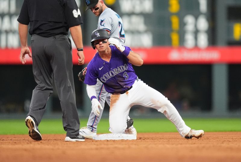 Aug 28, 2024; Denver, Colorado, USA; Colorado Rockies catcher Drew Romo (3) reaches second on a throwing error in the third inning against the Colorado Rockiesat Coors Field. Mandatory Credit: Ron Chenoy-USA TODAY Sports