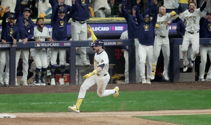 Oct 2, 2024; Milwaukee, Wisconsin, USA; Milwaukee Brewers outfielder Garrett Mitchell (5) reacts after hitting a two-run home run during the eighth inning against the New York Mets in game two of their wild-card playoff game at American Family Field. Mandatory Credit: Mark Hoffman-Imagn Images