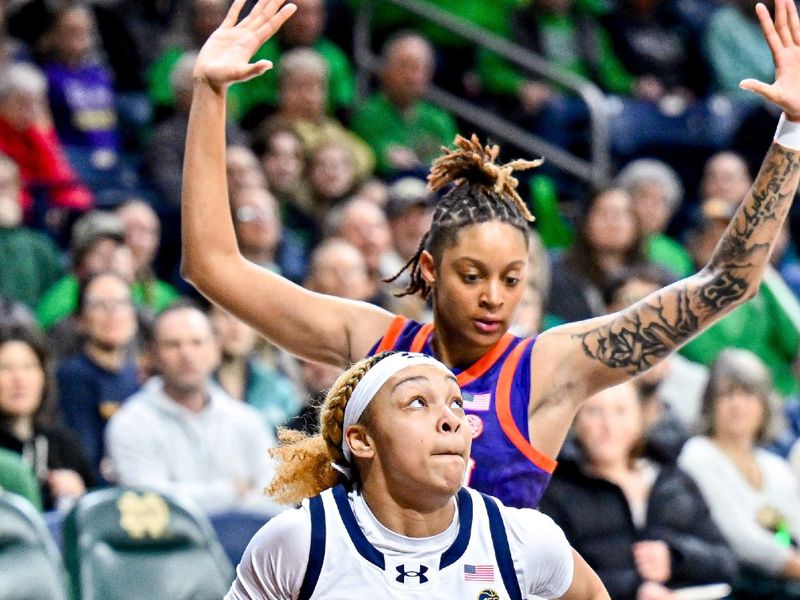 Feb 22, 2024; South Bend, Indiana, USA; Notre Dame Fighting Irish guard Hannah Hidalgo (3) drives to the basket as Clemson Tigers guard Rubi Whitehorn (22) defends in the second half at the Purcell Pavilion. Mandatory Credit: Matt Cashore-USA TODAY Sports