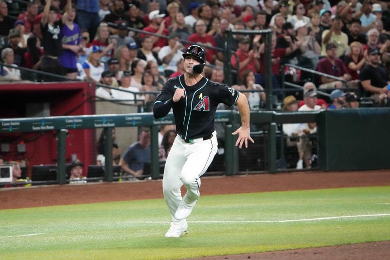 Sep 1, 2024; Phoenix, Arizona, USA; Arizona Diamondbacks outfielder Randal Grichuk (15) rounds third and scores a run against the Los Angeles Dodgers during the second inning at Chase Field. Mandatory Credit: Joe Camporeale-USA TODAY Sports