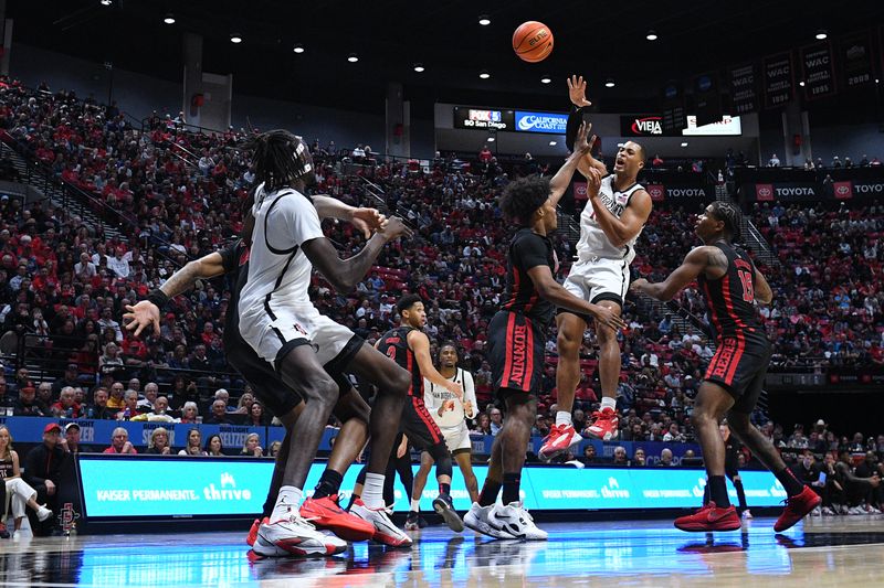 Jan 6, 2024; San Diego, California, USA; San Diego State Aztecs forward Jaedon LeDee (13) passes the ball during the second half against the UNLV Rebels at Viejas Arena. Mandatory Credit: Orlando Ramirez-USA TODAY Sports