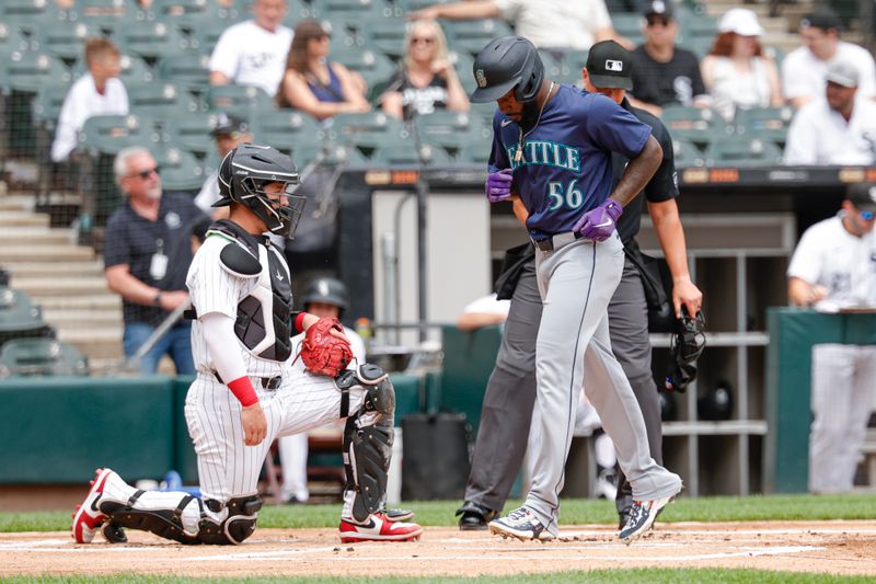 Jul 28, 2024; Chicago, Illinois, USA; Seattle Mariners outfielder Randy Arozarena (56) scores against the Chicago White Sox during the first inning at Guaranteed Rate Field. Mandatory Credit: Kamil Krzaczynski-USA TODAY Sports