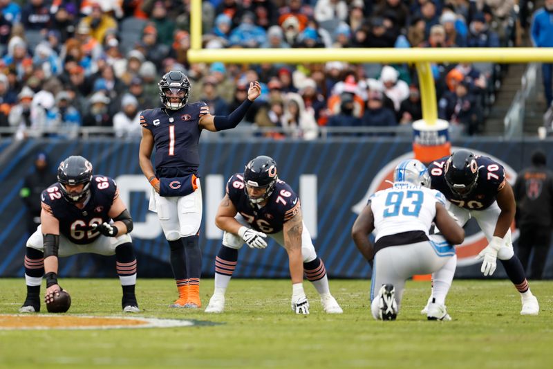 Chicago Bears quarterback Justin Fields (1) signals during the second half of an NFL football game against the Detroit Lions, Sunday, Dec. 10, 2023, in Chicago. (AP Photo/Kamil Krzaczynski)