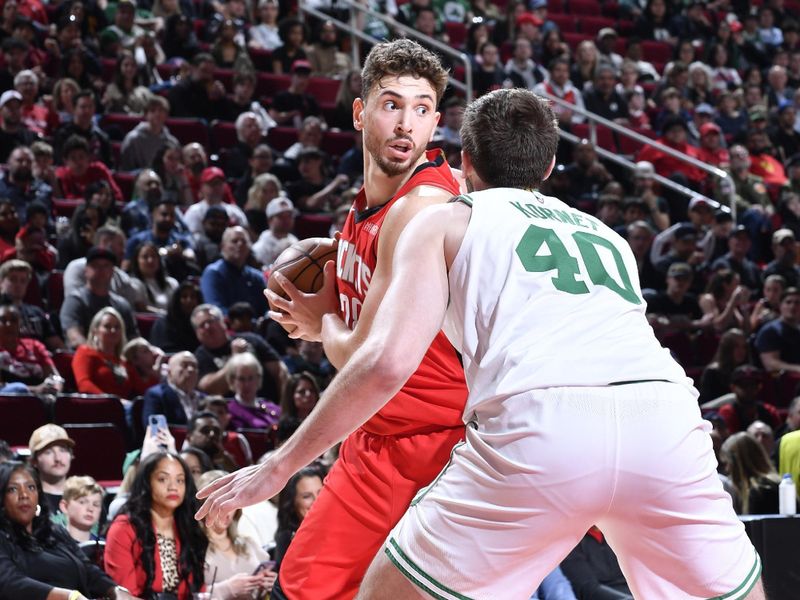 HOUSTON, TX - JANUARY 3:  Alperen Sengun #28 of the Houston Rockets looks to pass the ball during the game against the Boston Celtics on January 3, 2025 at the Toyota Center in Houston, Texas. NOTE TO USER: User expressly acknowledges and agrees that, by downloading and or using this photograph, User is consenting to the terms and conditions of the Getty Images License Agreement. Mandatory Copyright Notice: Copyright 2025 NBAE (Photo by Logan Riely/NBAE via Getty Images)