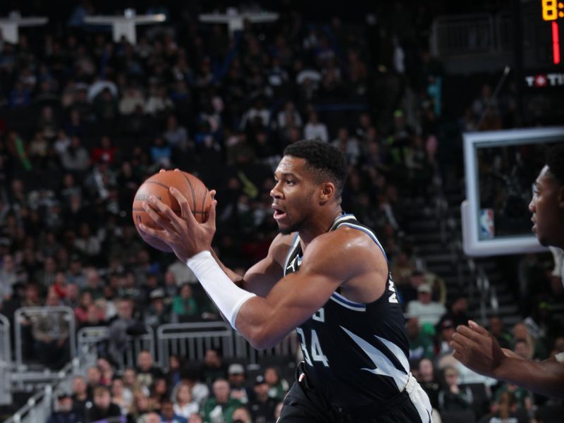 MILWAUKEE, WI - NOVEMBER 12:  Giannis Antetokounmpo #34 of the Milwaukee Bucks looks to pass the ball during the game against the Toronto Raptors  during the Emirates NBA Cup game on November 12, 2024 at Fiserv Forum Center in Milwaukee, Wisconsin. NOTE TO USER: User expressly acknowledges and agrees that, by downloading and or using this Photograph, user is consenting to the terms and conditions of the Getty Images License Agreement. Mandatory Copyright Notice: Copyright 2024 NBAE (Photo by Gary Dineen/NBAE via Getty Images).