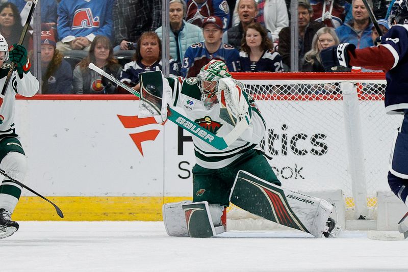 Apr 9, 2024; Denver, Colorado, USA; Minnesota Wild goaltender Filip Gustavsson (32) makes a save in the first period against the Colorado Avalanche at Ball Arena. Mandatory Credit: Isaiah J. Downing-USA TODAY Sports