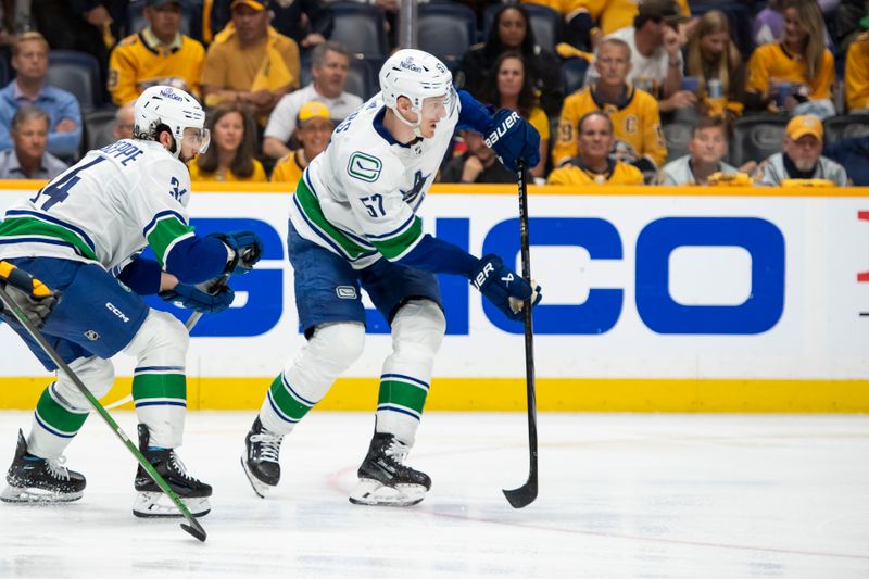 May 3, 2024; Nashville, Tennessee, USA; Vancouver Canucks defenseman Tyler Myers (57) skates with the puck  against the Nashville Predators during the third period in game six of the first round of the 2024 Stanley Cup Playoffs at Bridgestone Arena. Mandatory Credit: Steve Roberts-USA TODAY Sports