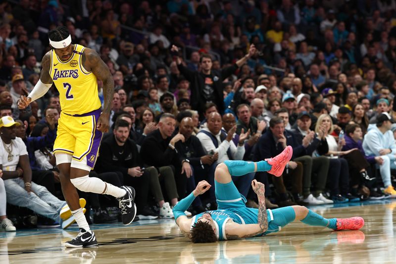 CHARLOTTE, NORTH CAROLINA - JANUARY 27: LaMelo Ball #1 of the Charlotte Hornets falls to the ground following a left ankle sprain after colliding with Jarred Vanderbilt #2 of the Los Angeles Lakers during the second quarter of the game at Spectrum Center on January 27, 2025 in Charlotte, North Carolina. NOTE TO USER: User expressly acknowledges and agrees that, by downloading and or using this photograph, User is consenting to the terms and conditions of the Getty Images License Agreement. (Photo by Jared C. Tilton/Getty Images)