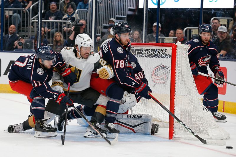 Mar 4, 2024; Columbus, Ohio, USA; Columbus Blue Jackets defenseman Damon Severson (78) clears a loose puck against the Vegas Golden Knights during the first period at Nationwide Arena. Mandatory Credit: Russell LaBounty-USA TODAY Sports