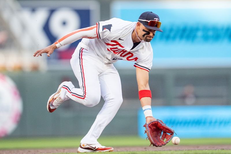May 10, 2025; Minneapolis, Minnesota, USA; Minnesota Twins third base Royce Lewis (23) fields a ball hit by San Francisco Giants outfielder Heliot Ramos (17) in the fifth inning at Target Field. Mandatory Credit: Matt Blewett-Imagn Images