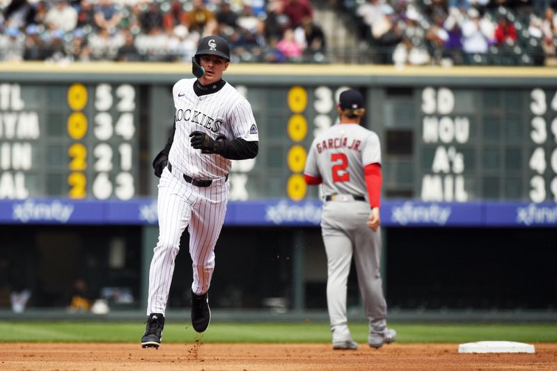 Apr 19, 2025; Denver, Colorado, USA; Colorado Rockies outfielder Mickey Moniak (22) runs the bases after a home run during the second inning against the Washington Nationals at Coors Field. Mandatory Credit: Christopher Hanewinckel-Imagn Images
