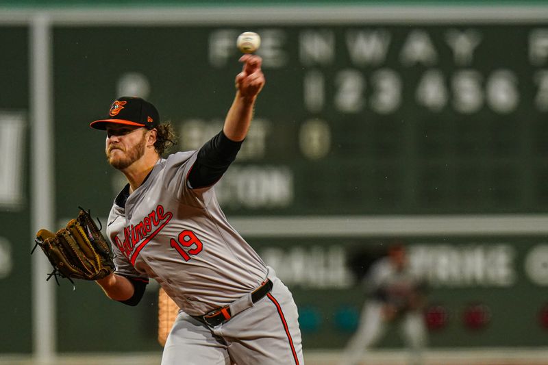 Apr 10, 2024; Boston, Massachusetts, USA; Baltimore Orioles pitcher Cole Irvin (19) throws a pitch against the Boston Red Sox in the first inning at Fenway Park. Mandatory Credit: David Butler II-USA TODAY Sports