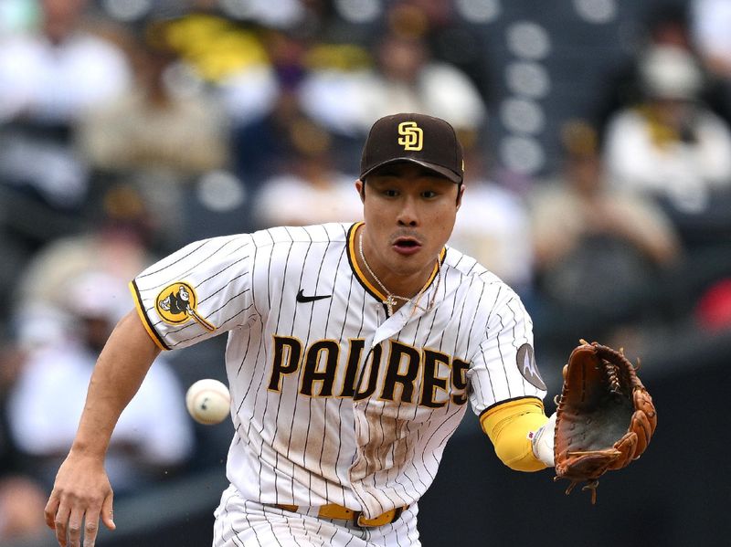 May 17, 2023; San Diego, California, USA; San Diego Padres third baseman Ha-seong Kim (7) fields a ground ball during the ninth inning against the Kansas City Royals at Petco Park. Mandatory Credit: Orlando Ramirez-USA TODAY Sports