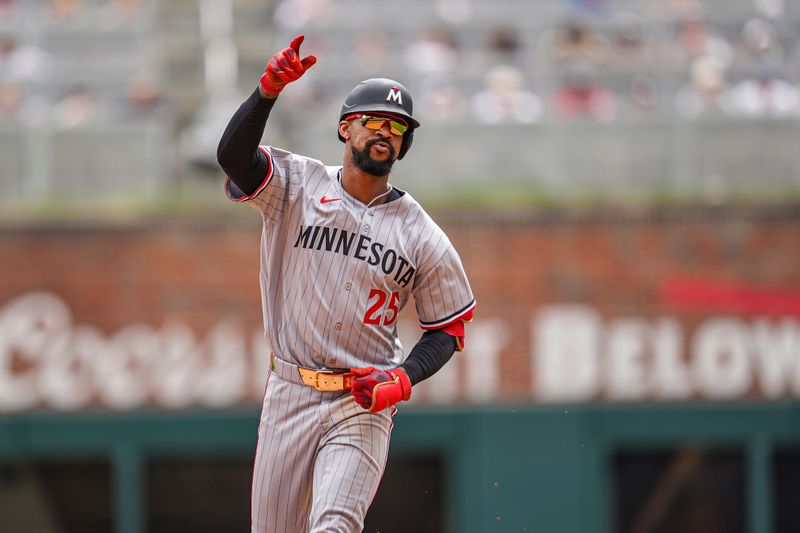Apr 20, 2025; Cumberland, Georgia, USA; Minnesota Twins center fielder Byron Buxton (25) reacts after hitting a home run against the Atlanta Braves during the seventh inning at Truist Park. Mandatory Credit: Dale Zanine-Imagn Images
