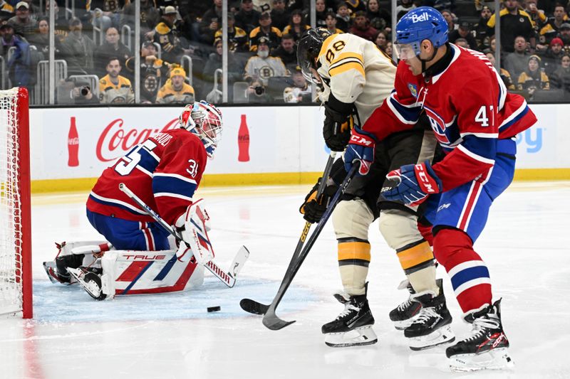 Jan 20, 2024; Boston, Massachusetts, USA; Boston Bruins right wing David Pastrnak (88) scores on Montreal Canadiens goaltender Sam Montembeault (35) during the third period at the TD Garden. Mandatory Credit: Brian Fluharty-USA TODAY Sports