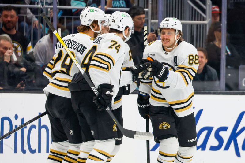 Feb 26, 2024; Seattle, Washington, USA; Boston Bruins right wing David Pastrnak (88) celebrates with teammates after scoring a goal against the Seattle Kraken during the first period at Climate Pledge Arena. Mandatory Credit: Joe Nicholson-USA TODAY Sports