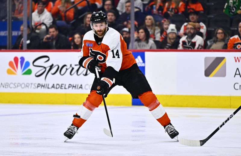 Feb 8, 2024; Philadelphia, Pennsylvania, USA; Philadelphia Flyers center Sean Couturier (14) passes the puck against the Winnipeg Jets in the third period at Wells Fargo Center. Mandatory Credit: Kyle Ross-USA TODAY Sports