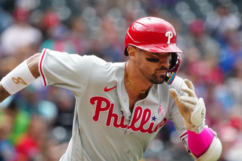 May 14, 2023; Denver, Colorado, USA; Philadelphia Phillies right fielder Nick Castellanos (8) runs out a single in the sixth inning against the Colorado Rockies at Coors Field. Mandatory Credit: Ron Chenoy-USA TODAY Sports